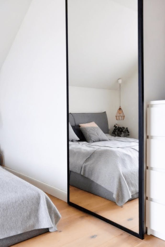 sliding door with a mirror, how to cover a small niche, a mirror in a metal frame, a sliding door in the bedroom, a large mirror in the bedroom