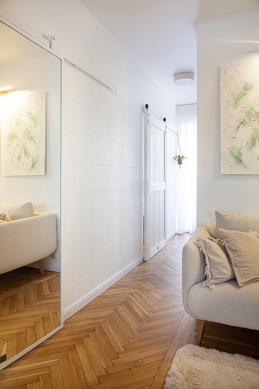 white sliding door in the corridor of a small apartment