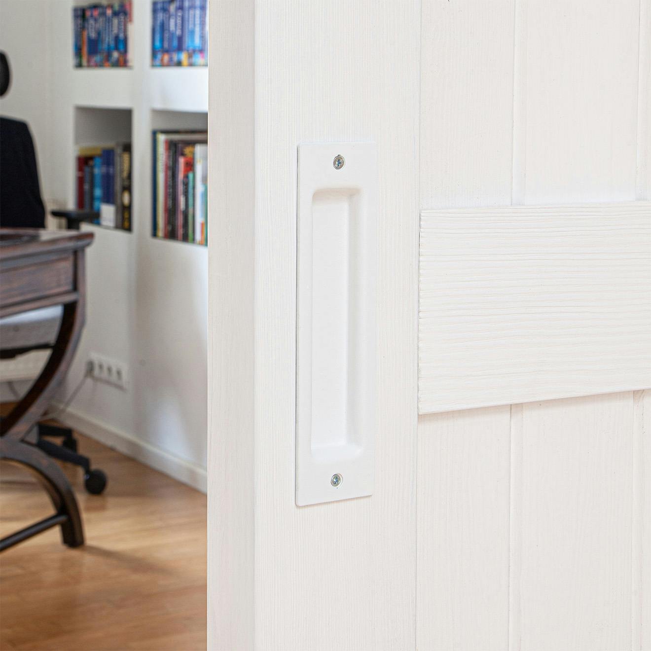 white door handle on a white wooden door