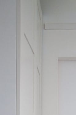 sliding door with a mirror, door with a mirror in a metal frame, sliding door in a modern interior, sliding door for a children's room